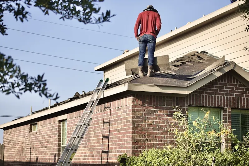 Professional roofer working on a residential roof in Hastings Ranch